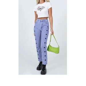 Princess Polly blue jeans with black hearts (on front)